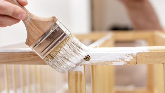 A person busy mastering the art of furniture restoration. 